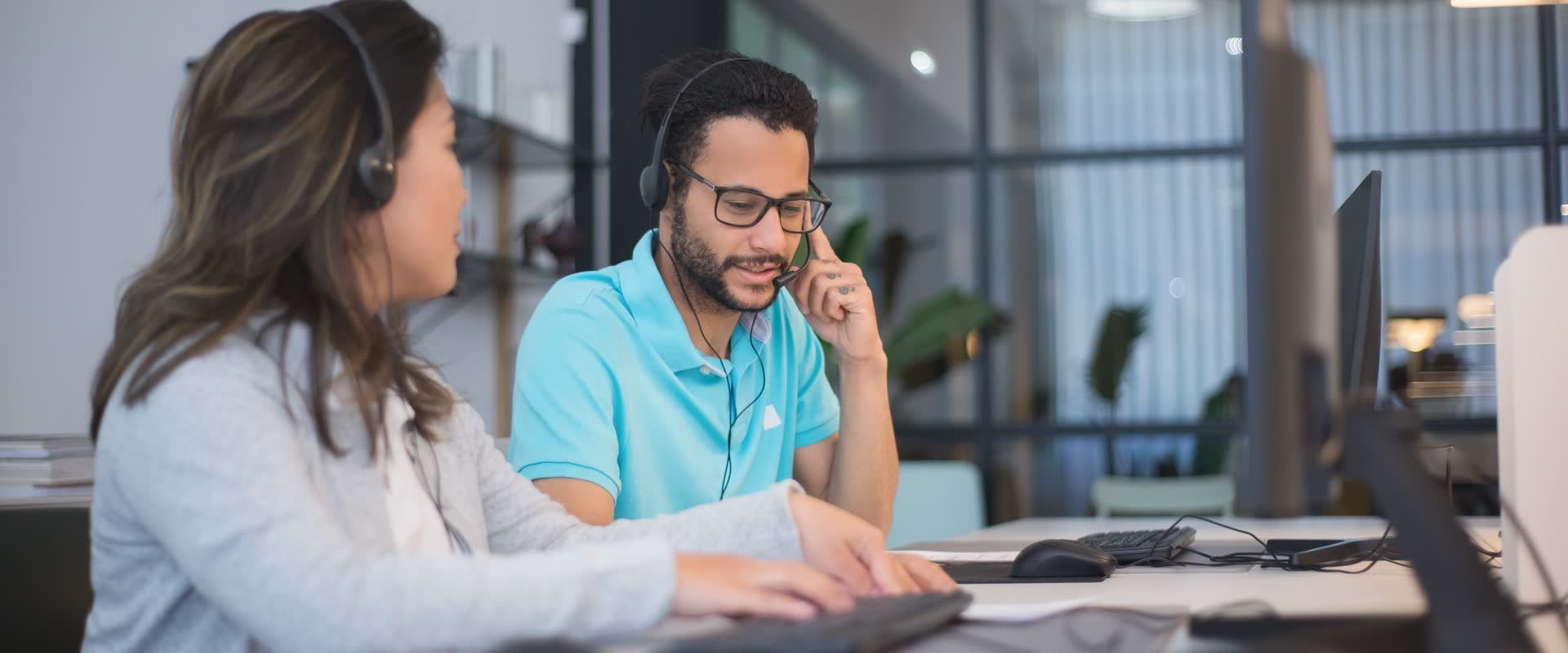 Shipper at a laptop writing to contact a freight broker