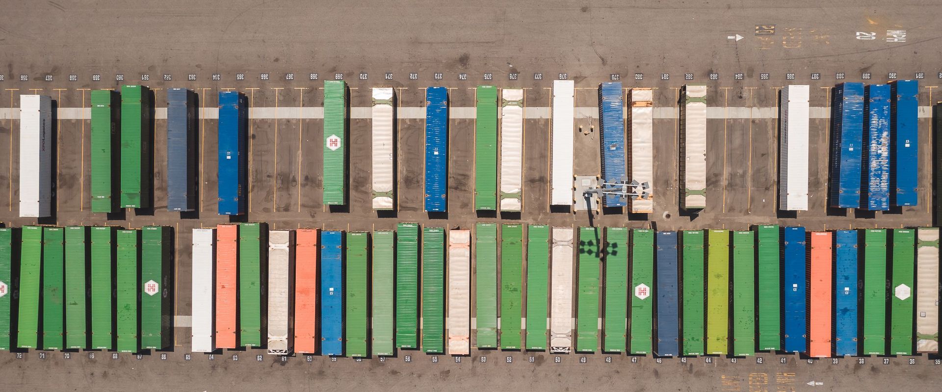 Stacked shipping containers seen from above. What is freight class? A number for how dense a load like this is.