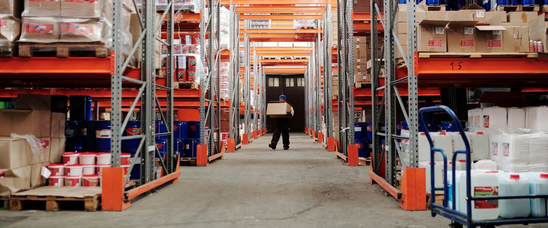 Palletized goods racked in a distribution warehouse, ready for freight shipping for manufacturers and wholesalers