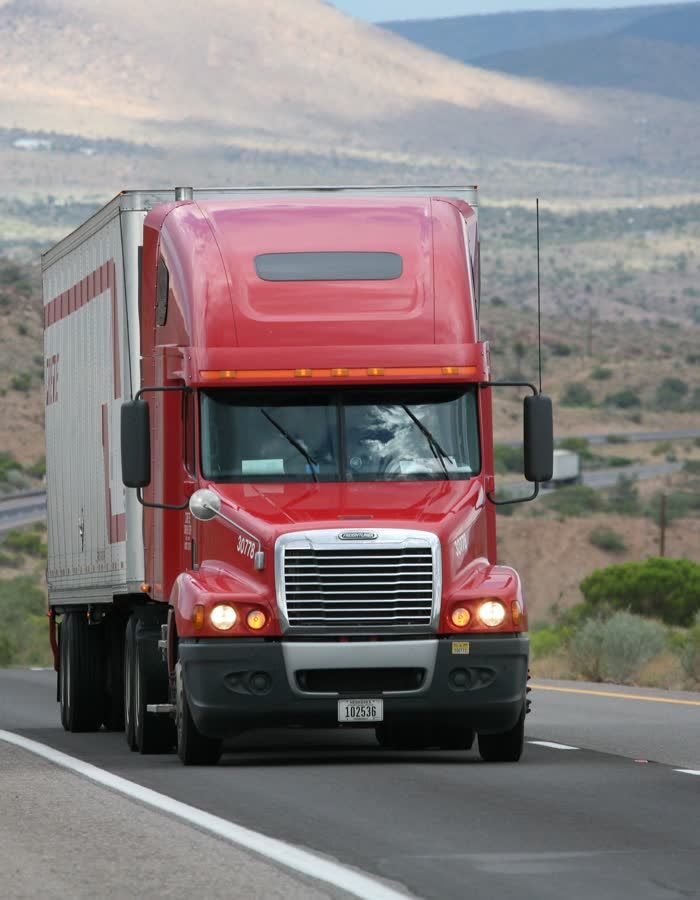 Freightliner tractor-trailer on a U.S. highway: get an LTL freight quote or a truckload freight quote for lanes like this